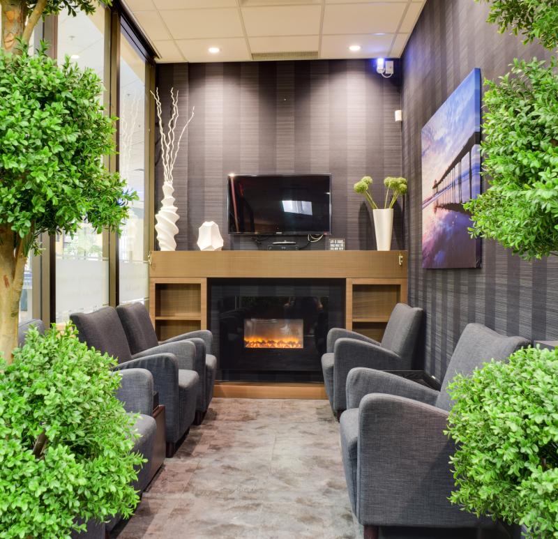 evergreen-dental-centre-clinic-reception-photo man smiling in dentists chair